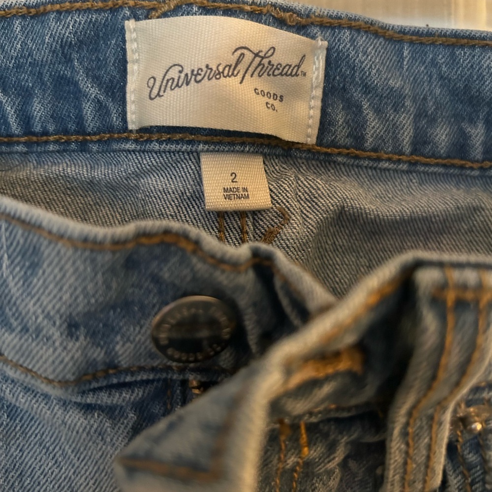 Universal thread, mid length, denim skirt, distressed.